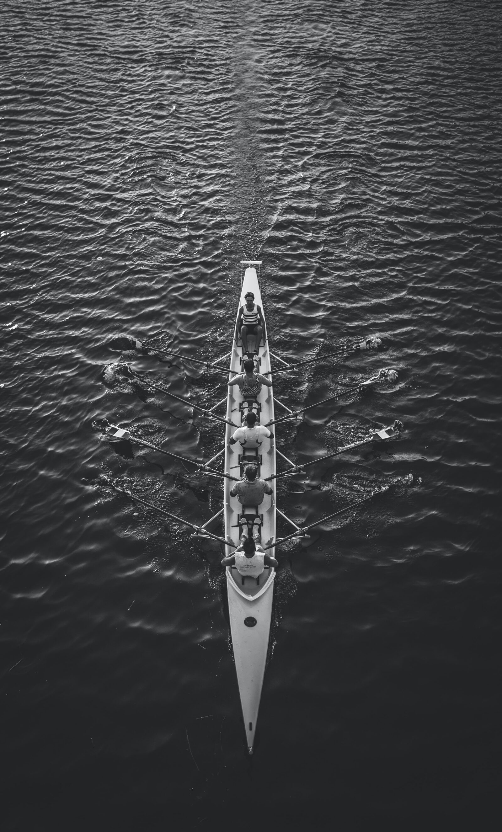 people riding boat on body of water photo