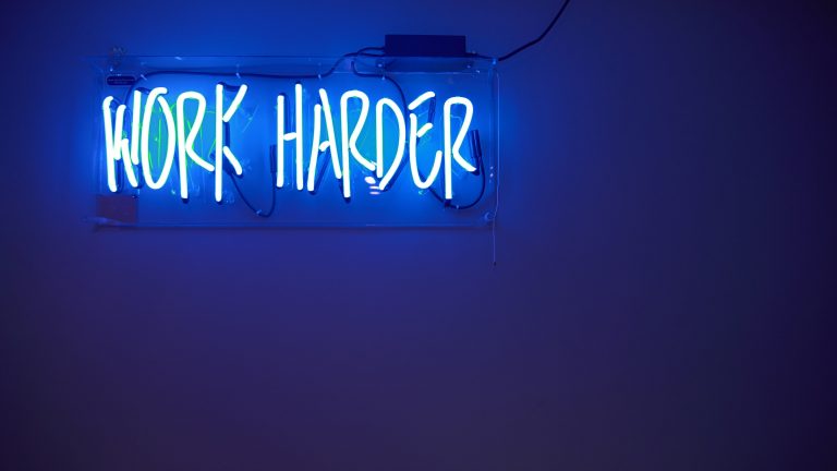 work harder neon sign photo